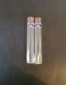 Two Handmade Small Glass Chillums on a brown background